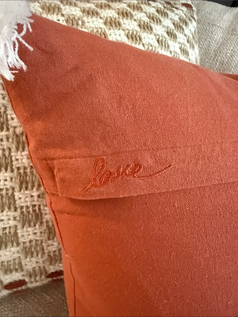 Ellen Degeneres Rust Orange Pillow with White Llama Rope Design